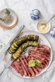 Ribeye with Hasselback zucchini and herb butter