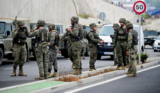Military escort migrants back to Morocco from Spain’s Ceuta enclave